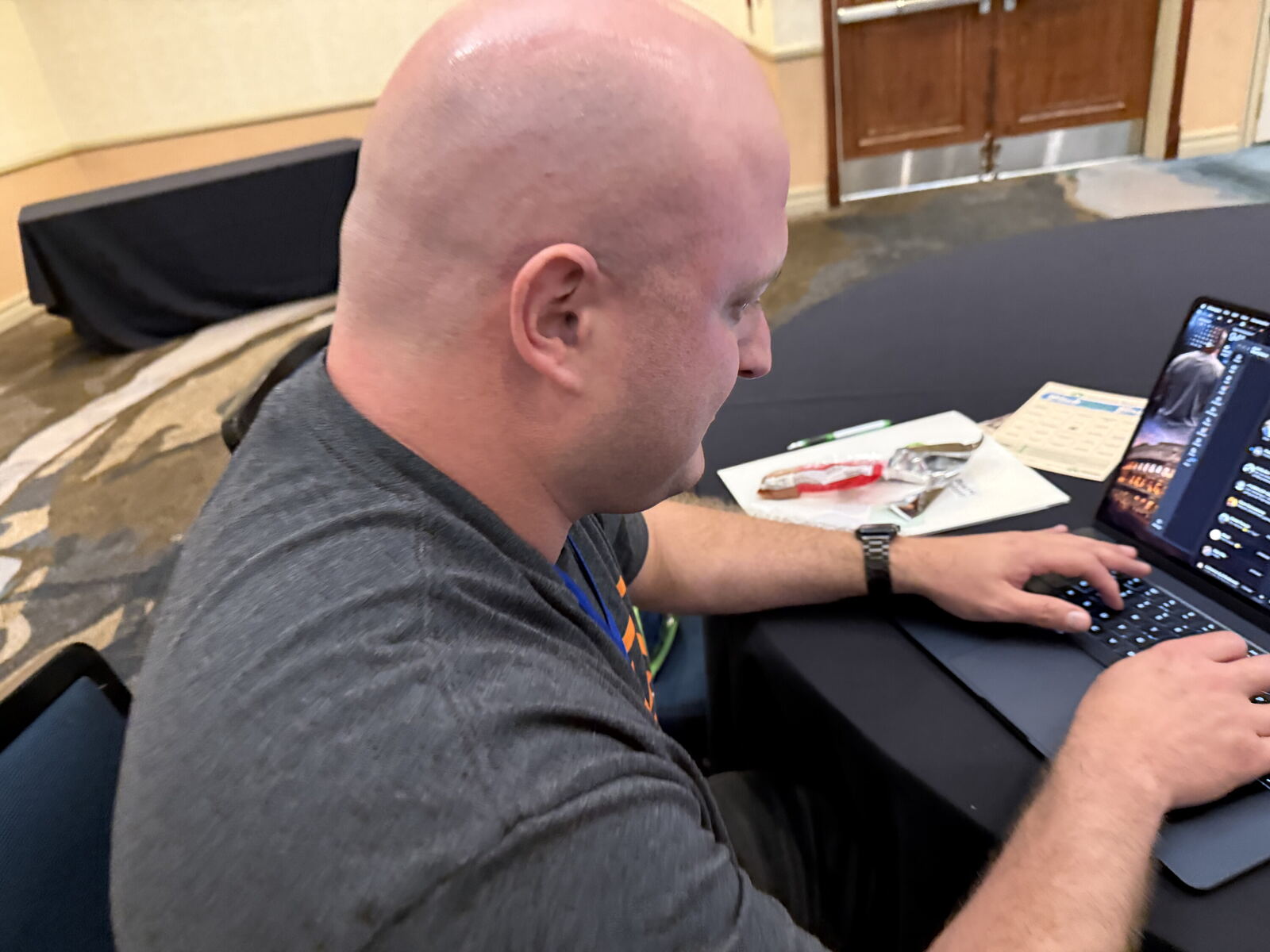 An attendee working along on his own laptop